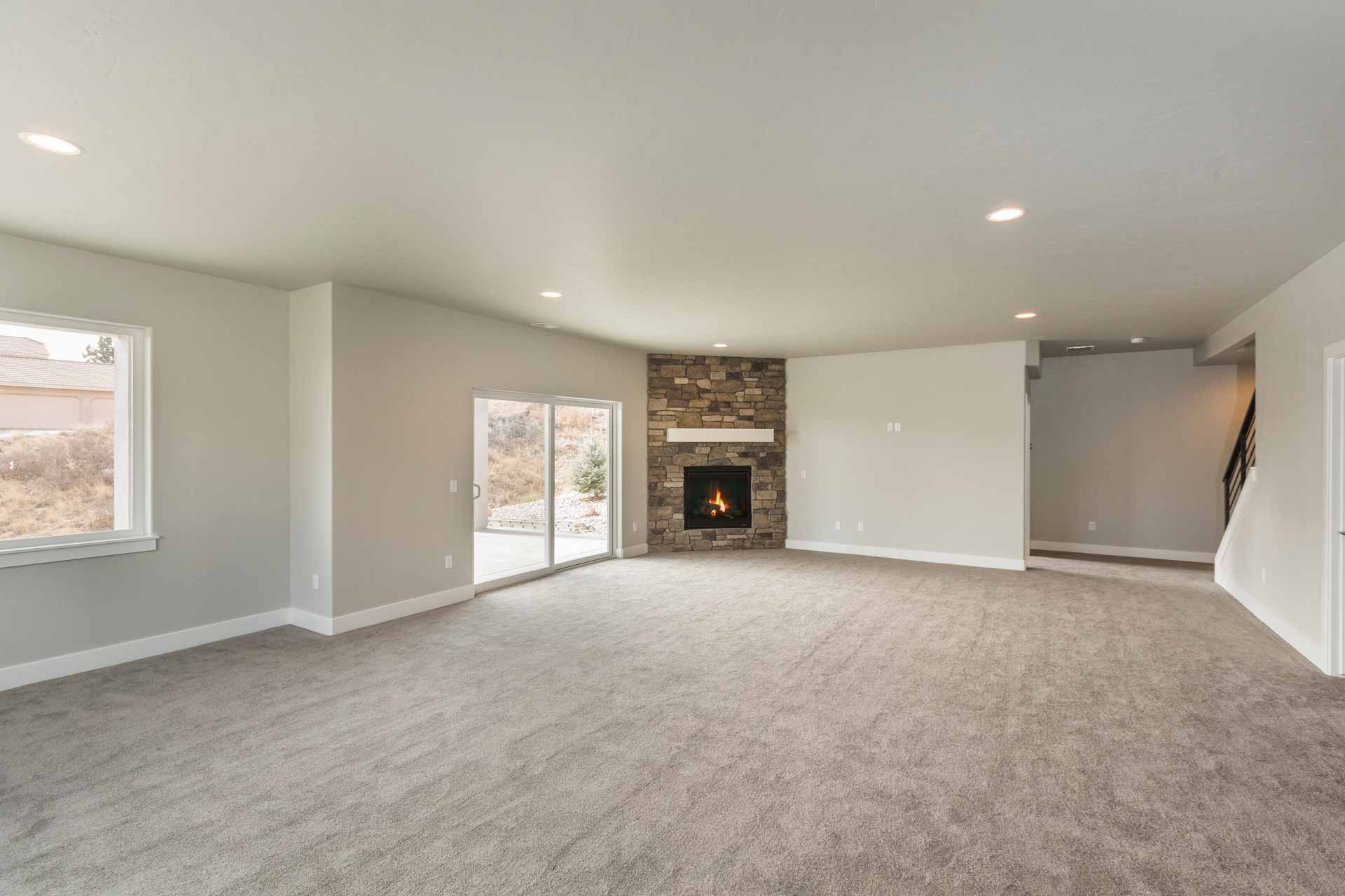 Finished basement with carpeting and fireplace. New construction.